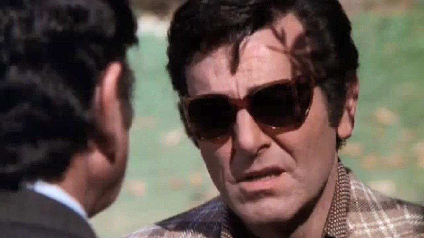 Still from Mask For a Charade