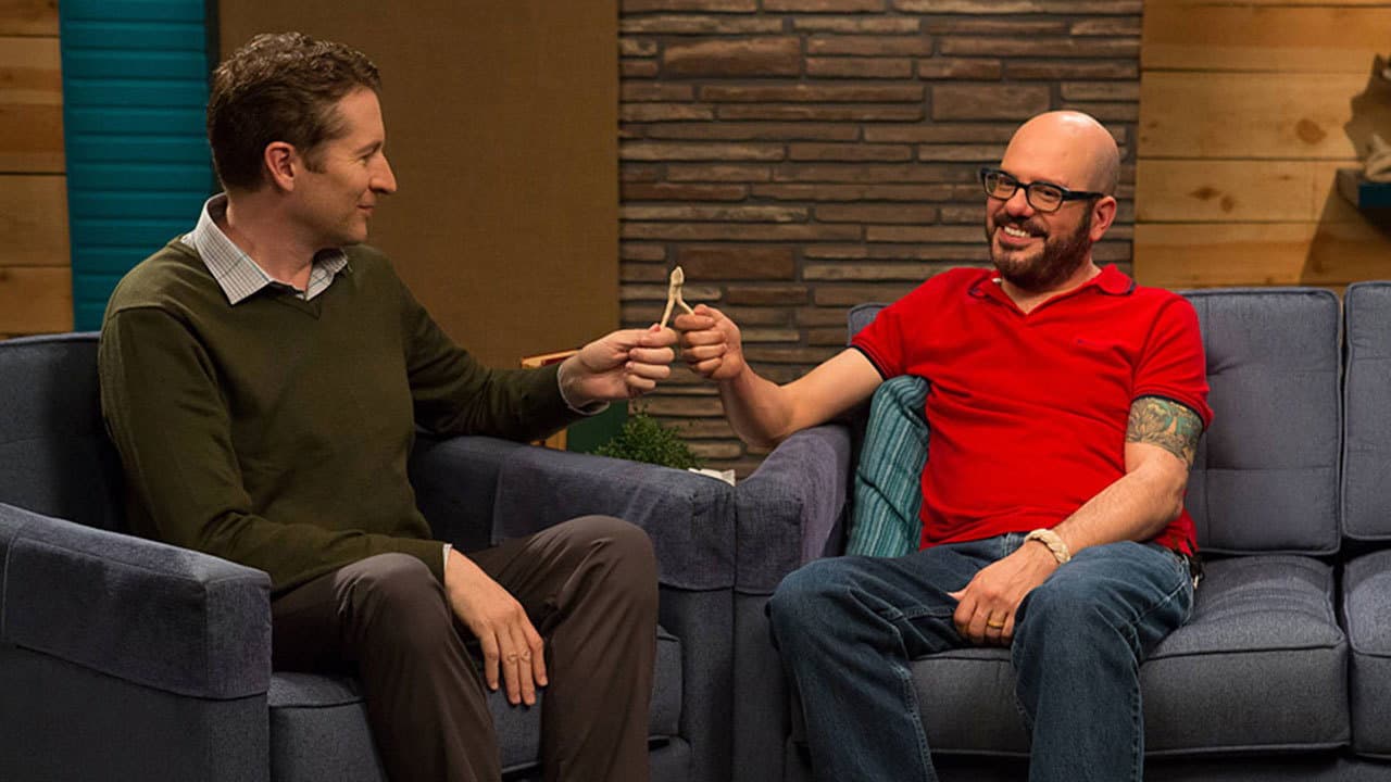 Still from David Cross Wears a Red Polo Shirt & Brown Shoes with Red Laces