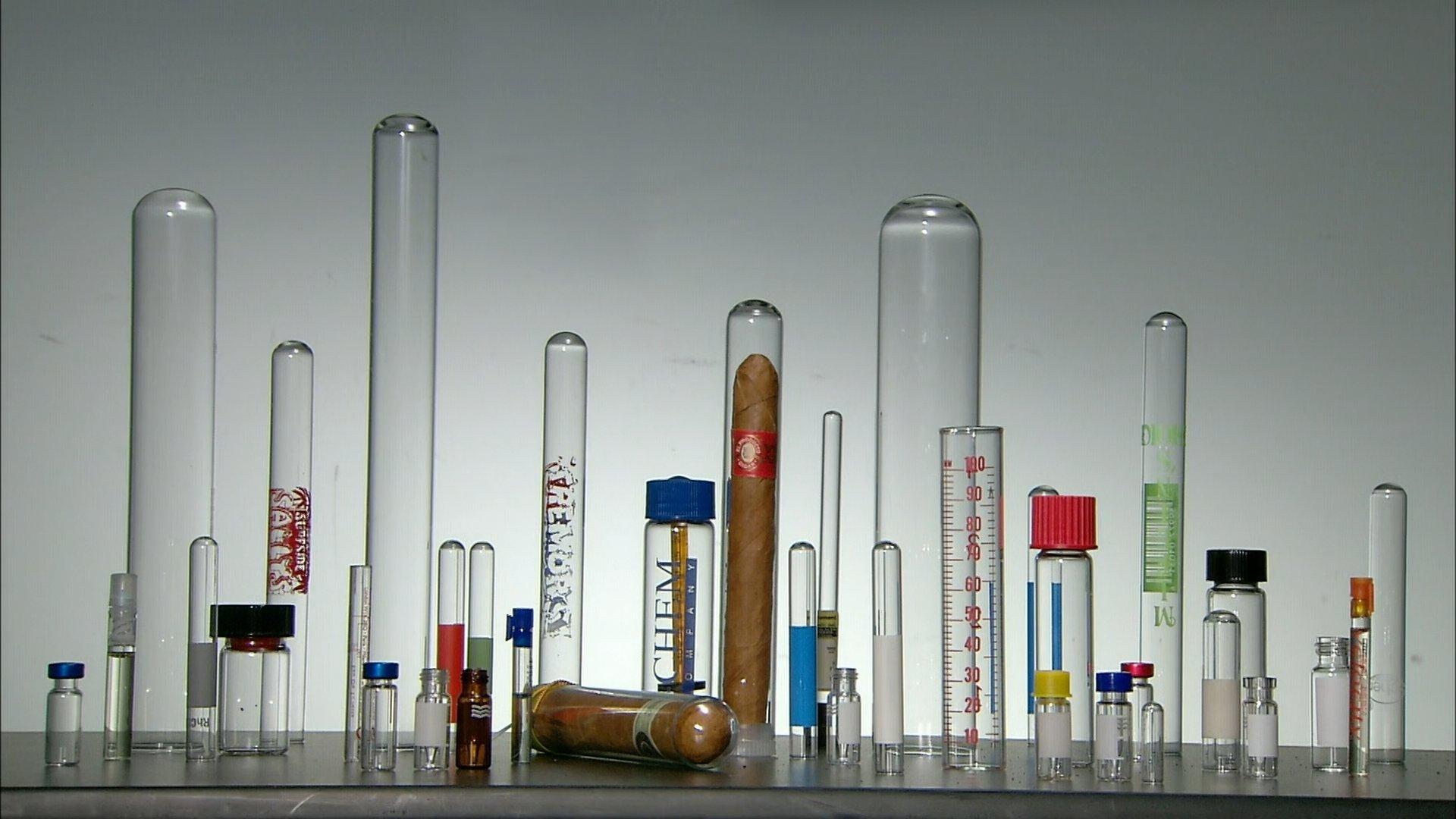 Still from Stainless Steel, Football Helmets, Resin Figurines, Laboratory Glassware