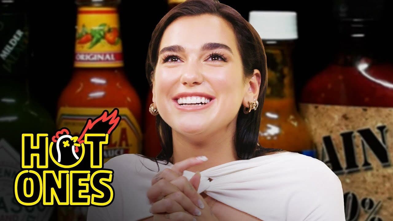 Still from Dua Lipa Sweats from Her Eyes While Eating Spicy Wings