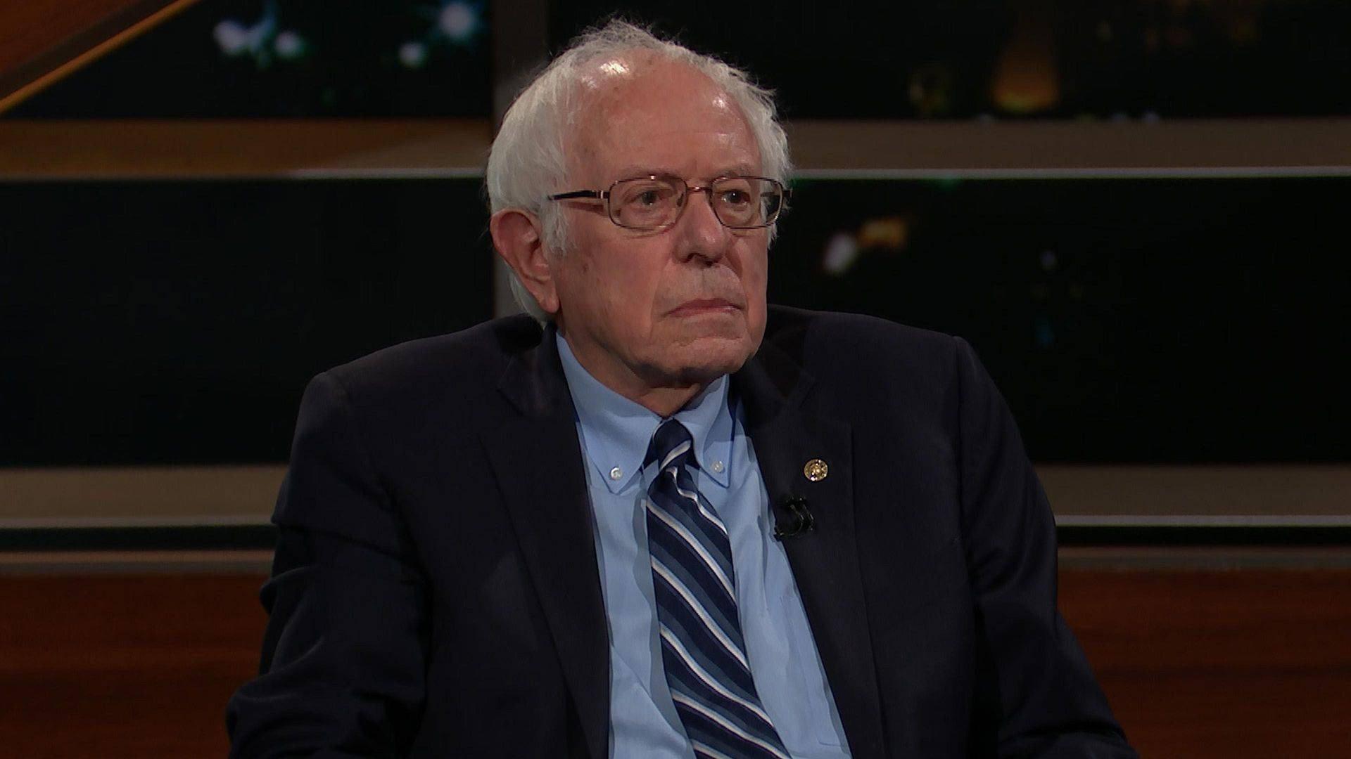 Still from March 3, 2023: Bernie Sanders, John Heiligman, Russell Brand
