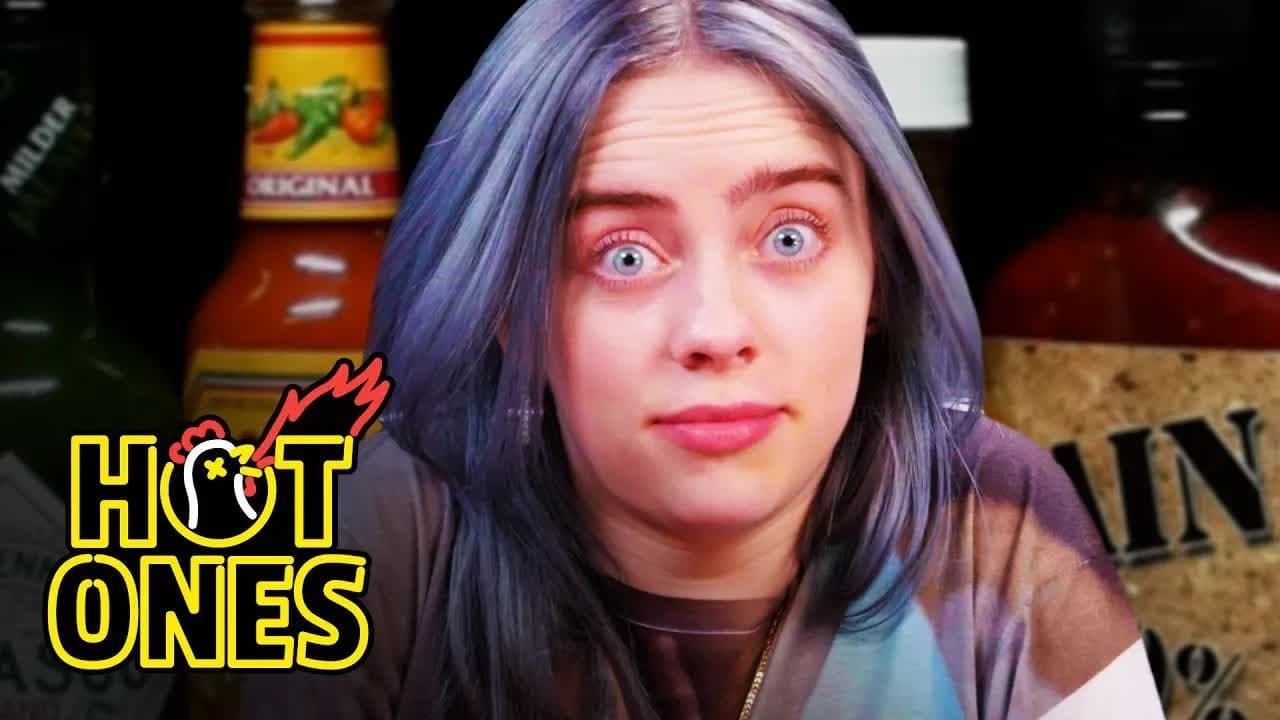Still from Billie Eilish Freaks Out While Eating Spicy Wings