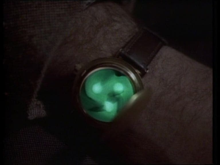 Still from Profile in Silver / Button, Button