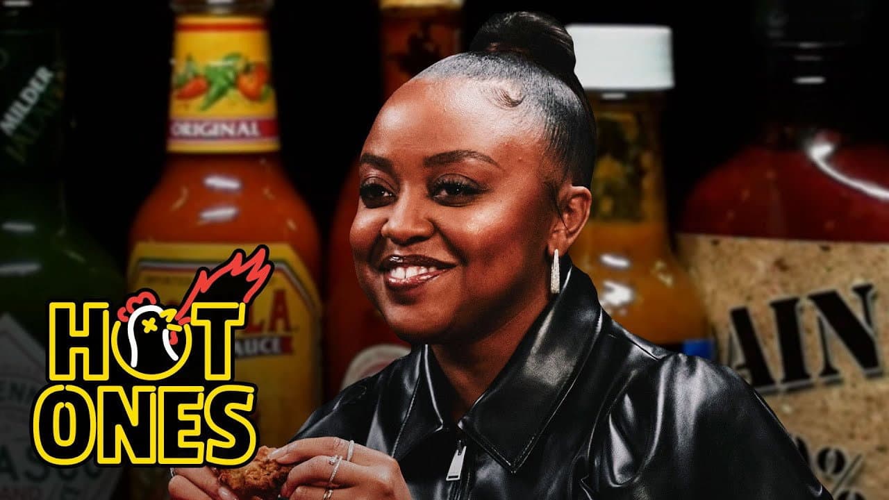 Still from Quinta Brunson Faces Her Fear of Hot Ones While Eating Spicy Wings