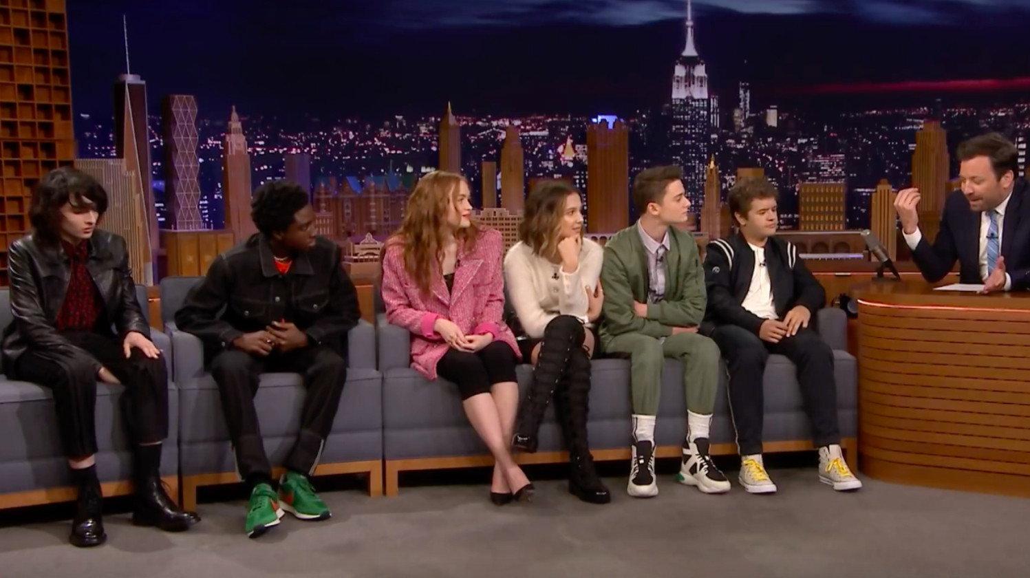Still from Millie Bobby Brown/Finn Wolfhard/Gaten Matarazzo/Caleb McLaughlin/Noah Schnapp/Sadie Sink/Ramy Youssef/Ivan Orkin