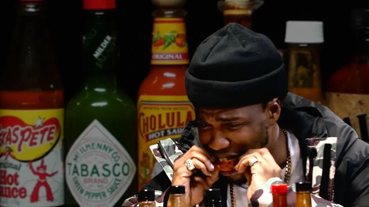 Still from Curren$y Talks Munchies, Industry Games, and Rap Dogs While Eating Spicy Wings