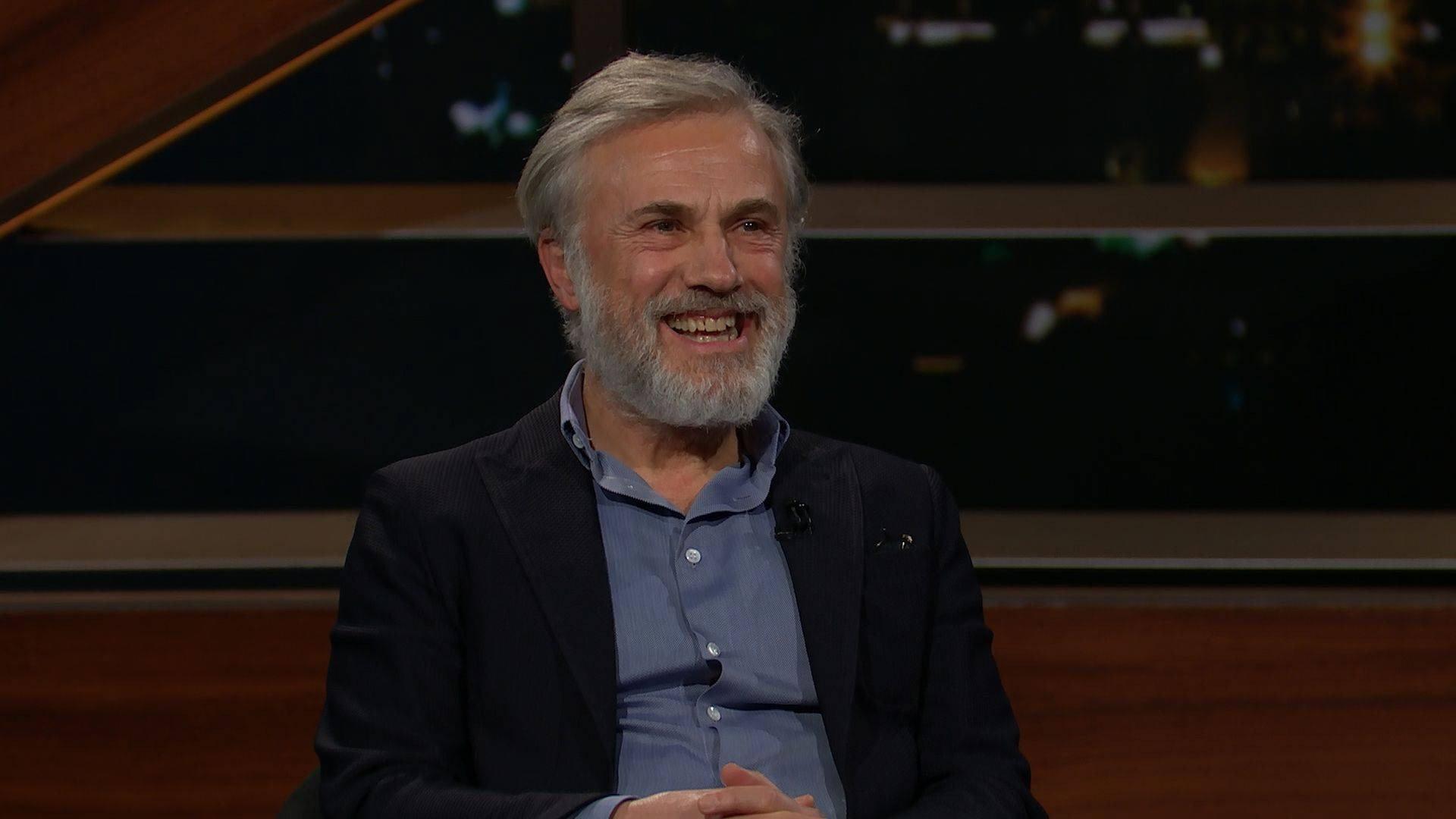 Still from February 17, 2023: Christoph Waltz, Ari Melber, Sarah Isgur