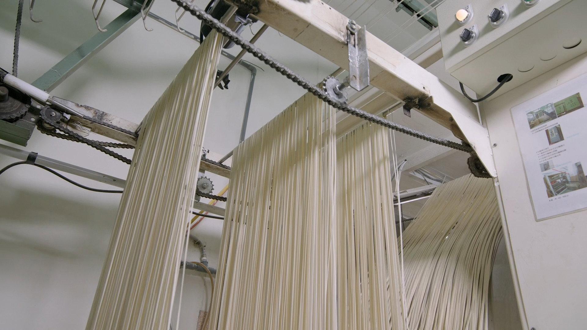 Still from Cotton, Rodeo Roping Chutes, Asian Noodles, Rotary Engines