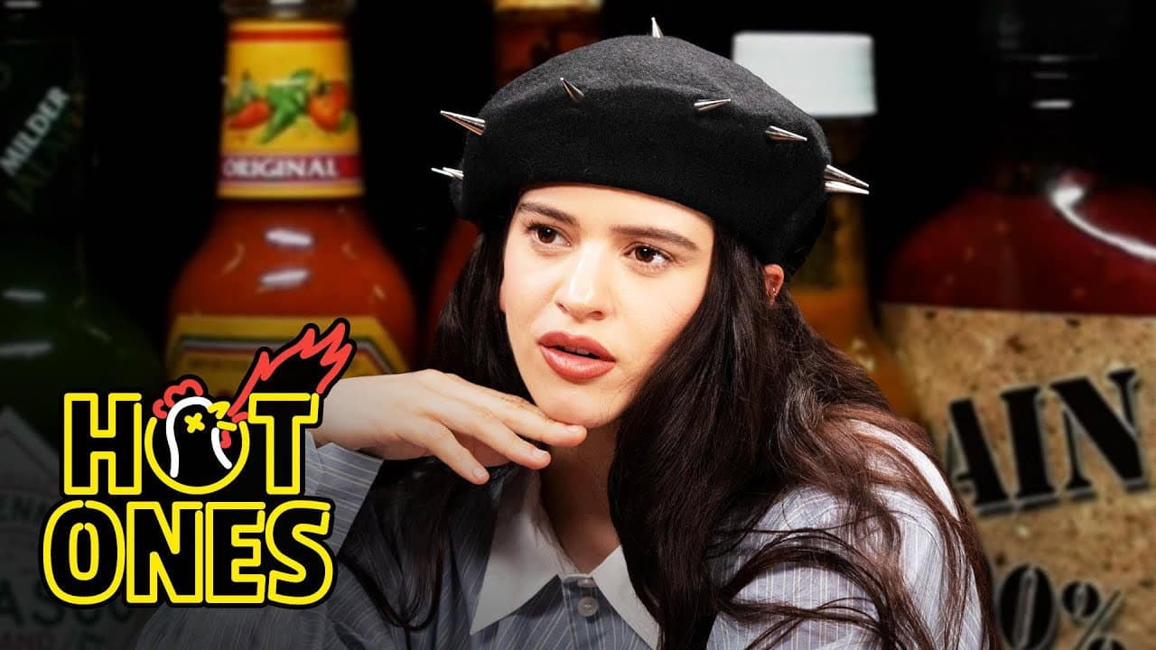 Still from Rosalía Can't Stop Laughing While Eating Spicy Wings