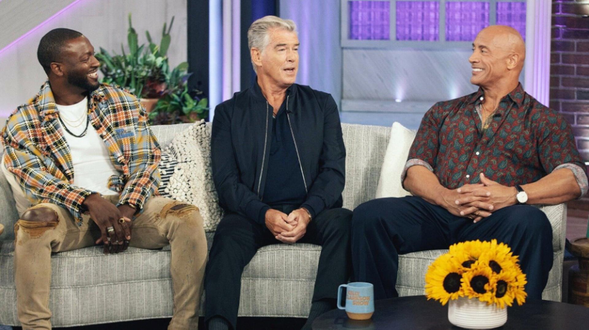 Still from Dwayne Johnson, Pierce Brosnan and the Black Adam Cast